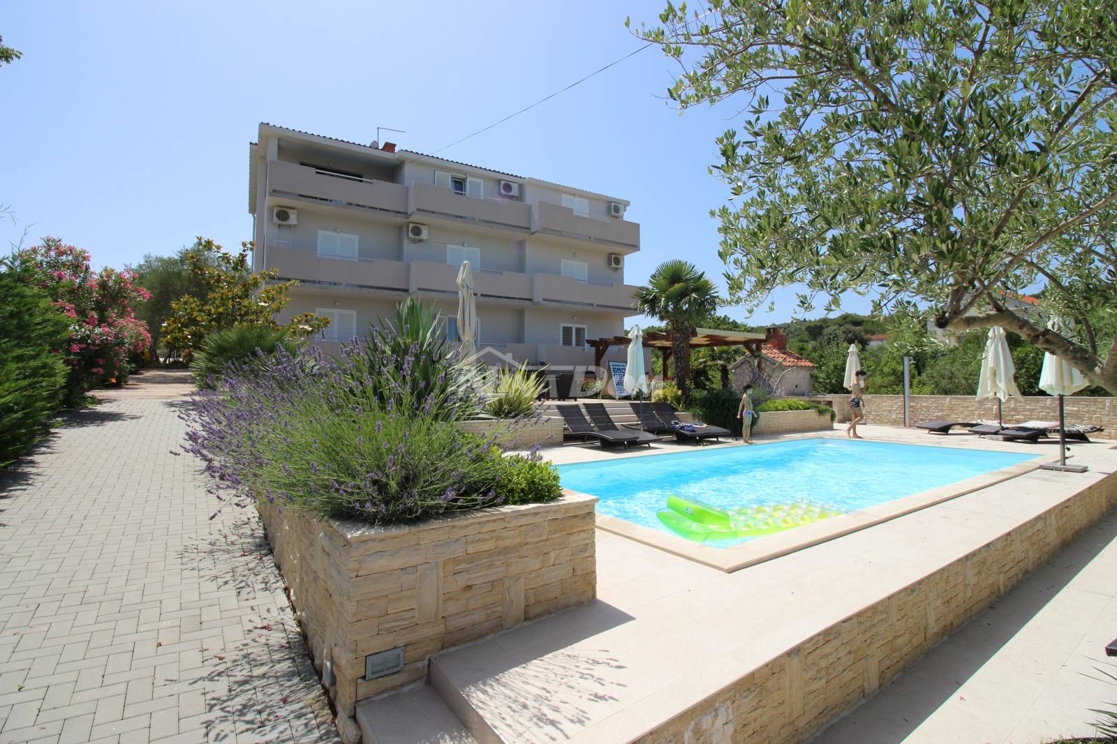 House with apartments and swimming pool